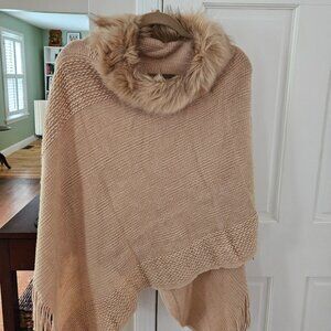 Shawl with fur trim.